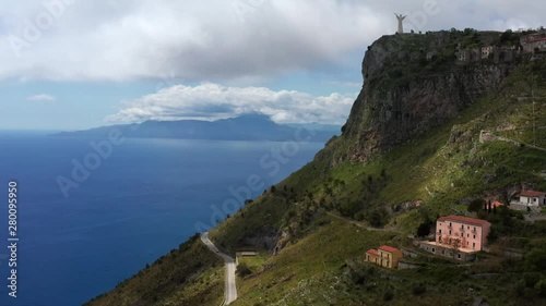 View at green hill with statue in Maratea town in Italy