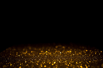 Golden abstract bokeh on black background. Holiday concept