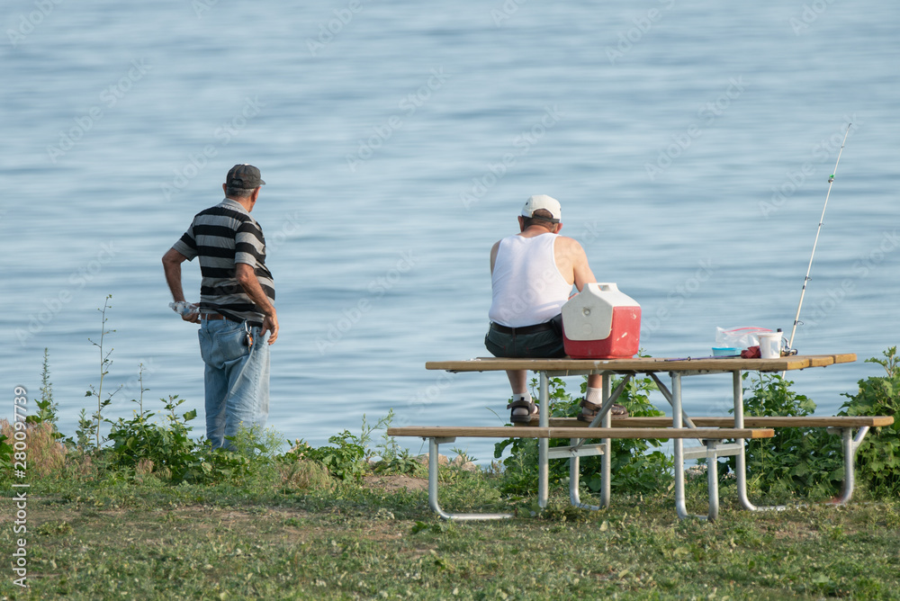Fototapeta premium unknown fishermen have spotted something in the water nearby