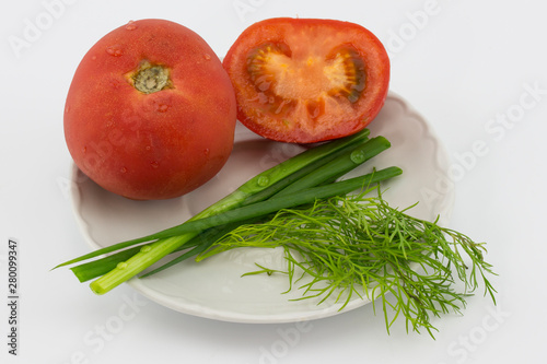 Spring onions and tomatoes in bowl isolated on white background cutout