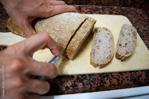 Hands Cutting Bread into Slices 5