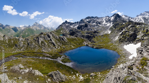 Fototapeta Naklejka Na Ścianę i Meble -  The Lac Bleu in Chianale, mountain lake in the italian alps of Cuneo, Piedmont, facing the famous Monviso peak (mount viso)