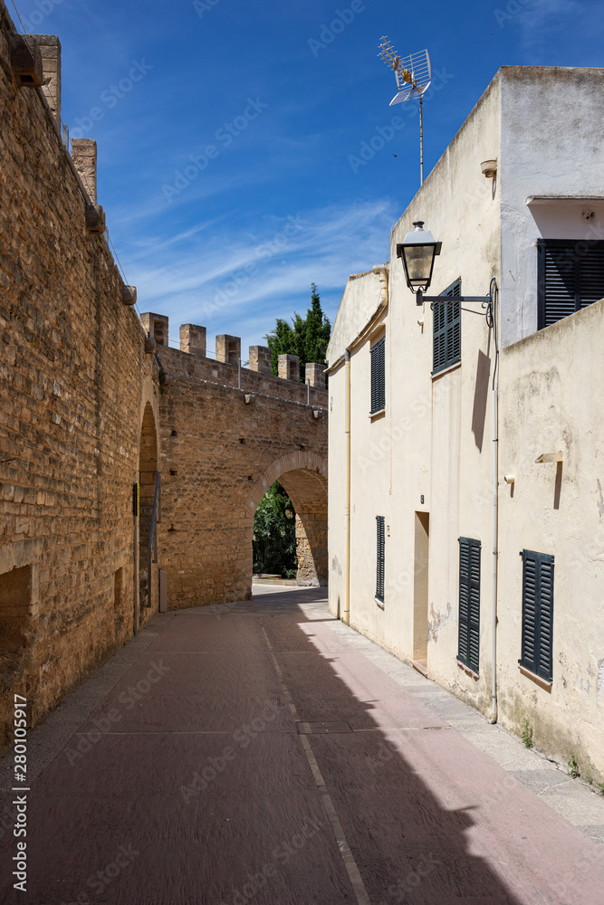 Narrow deserted street in the old medieval town of Alcudia, Mallorca