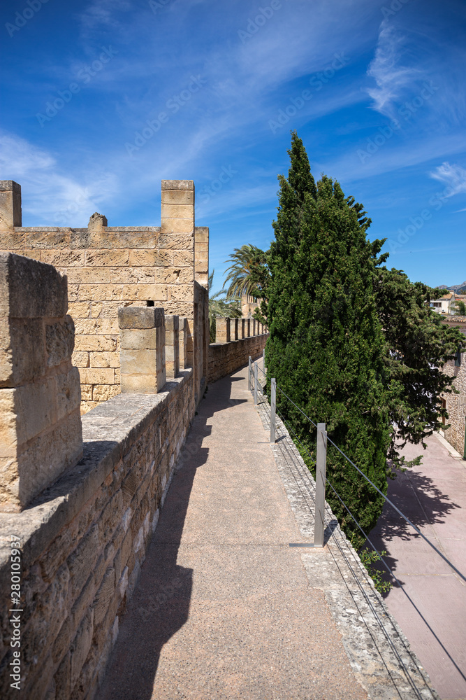 Narrow deserted street in the old medieval town of Alcudia, Mallorca