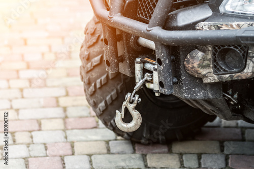 Close-up atv quadbike whick hook mounted on offroad all-terrain vehicle photo