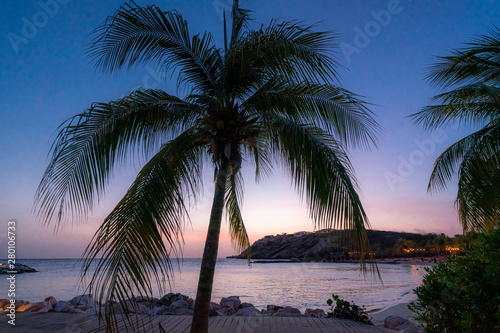 Sunset on a beach on the island of Curacao, in teh caribbean © Gail Johnson