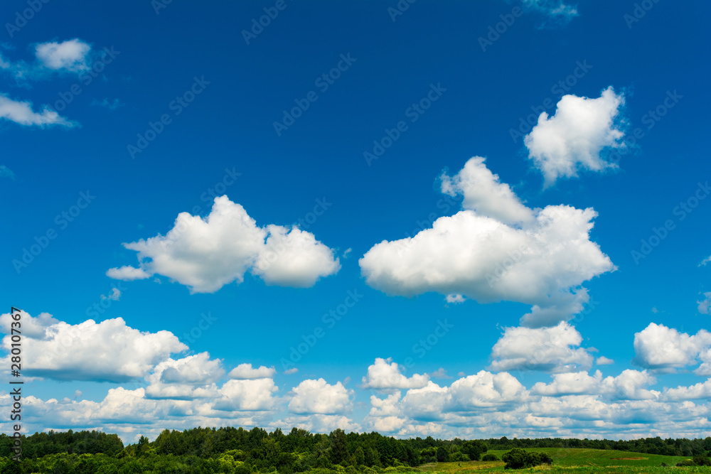 White, Fluffy Clouds In Blue Sky. Abstract Background From Clouds.