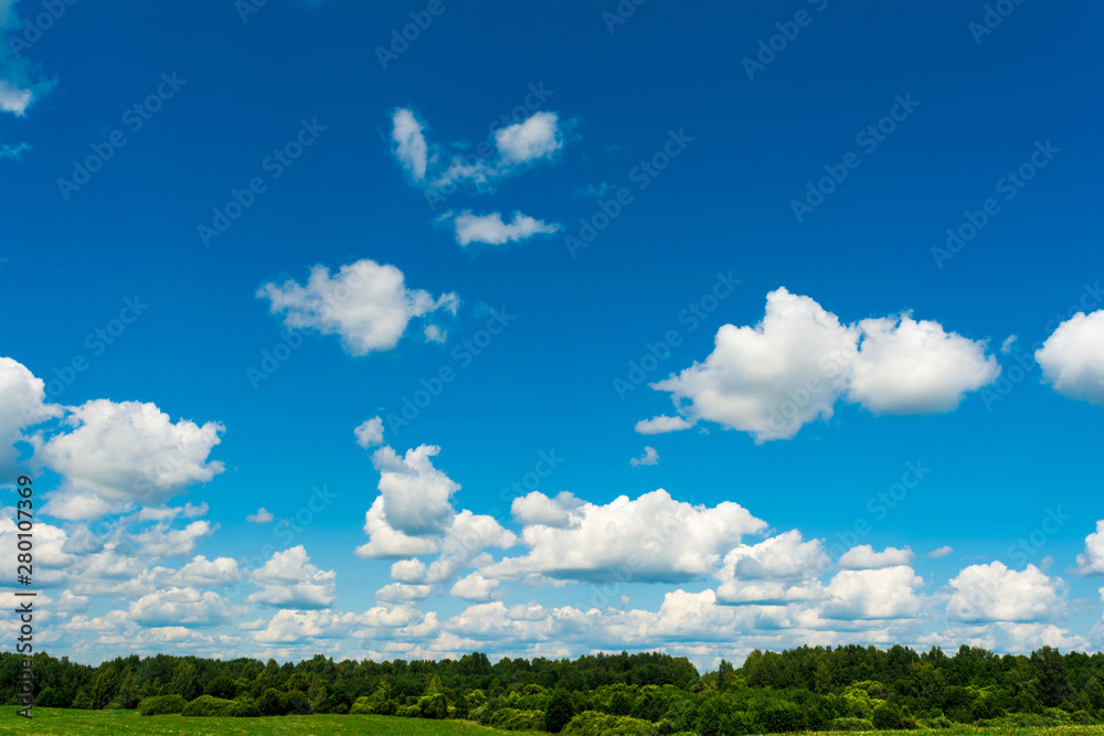 White, Fluffy Clouds In Blue Sky. Abstract Background From Clouds.