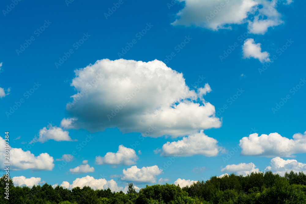 White, Fluffy Clouds In Blue Sky. Abstract Background From Clouds. White, Fluffy Clouds In Blue Sky. Abstract Background From Clouds.