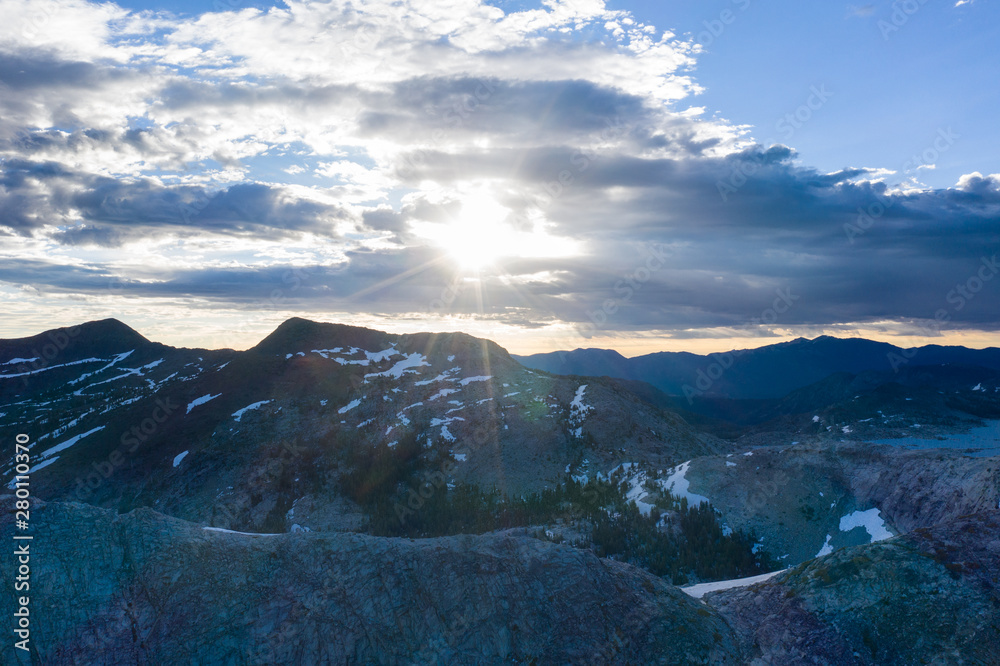 The sun rises over the high granite mountains in the Desolation Wilderness, California. This area is a popular backpacking destination and is full of granite rock formations and isolated lakes.
