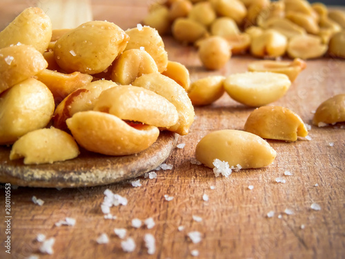 peanut on the wooden and blurry background salty close up