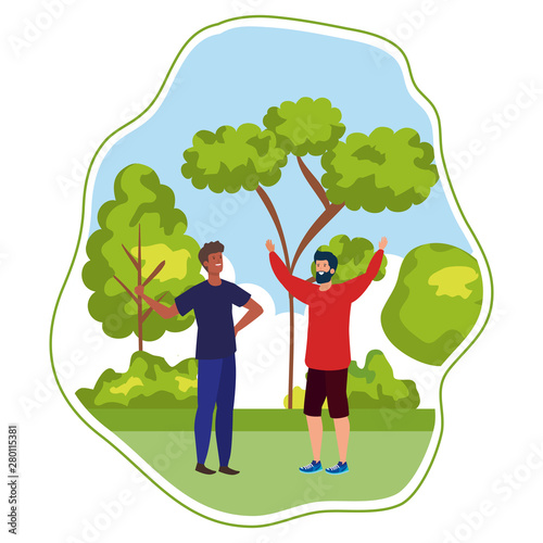 interracial young men friends celebrating in the park
