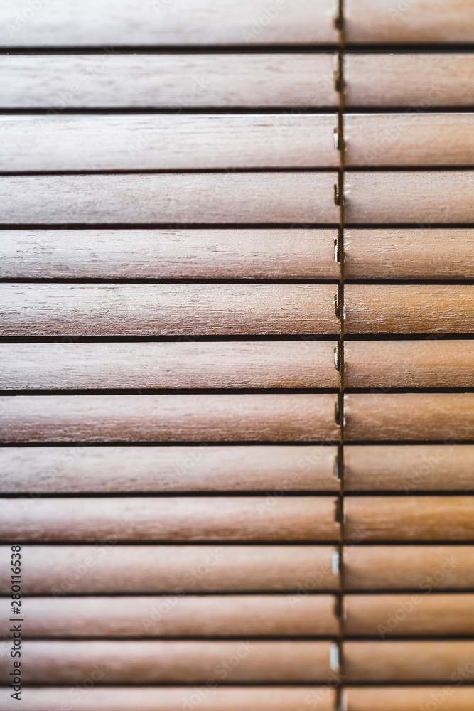 Wooden jalousie closeup. Eco style and concept. Geometric lines Wooden jalousie closeup. Eco style and concept. Geometric lines