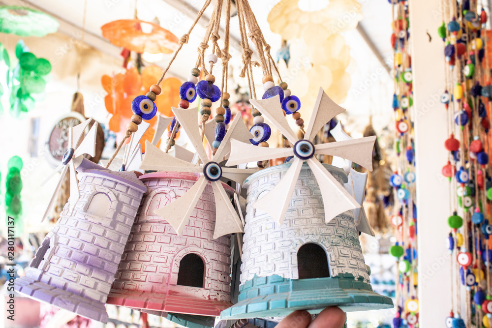 Naklejka premium They sell small windmill as a souvenir. The island of Cunda was