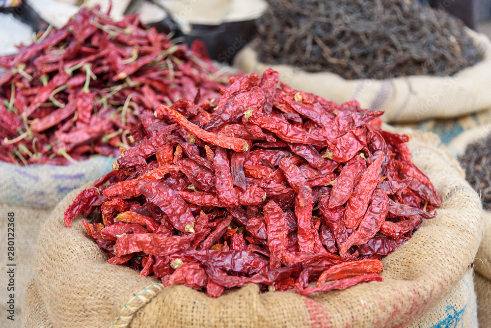 Bags and sacks with spices seeds roots for sale at local market