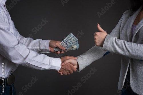 Obraz na plátne Close up photo of man hands giving money to a woman