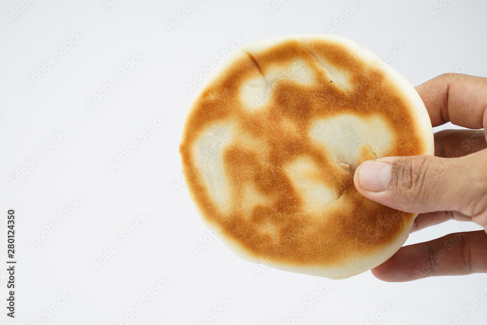 Holding bread in white background 