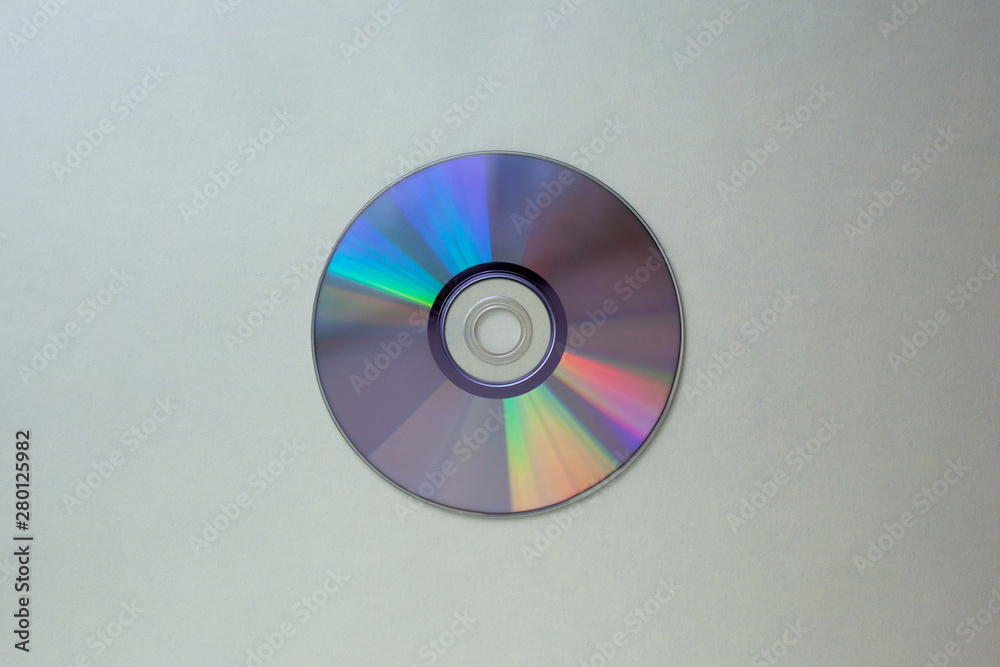cd compact disc on a gray background top view with copy space cd compact disc on a gray background top view with copy space