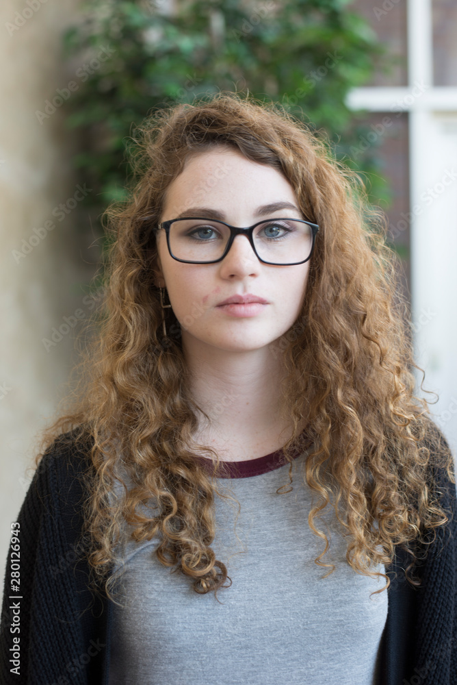 young woman with glasses close-up portrait young woman with glasses close-up portrait