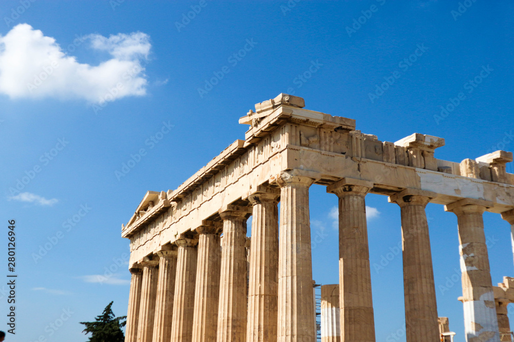 Facade with columns of the parthenon in athens greece against bright blue summer sky