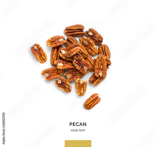Creative layout made of pecan nuts on white background.Flat lay. Food concept.
