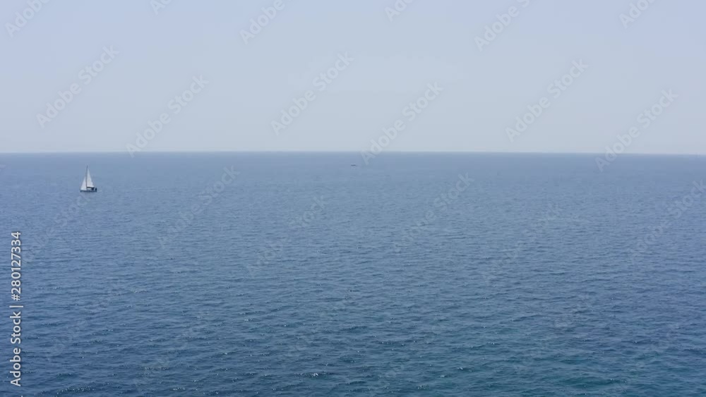 AERIAL of a Jet ski rider moving through ocean waves AERIAL of a Jet ski rider moving through ocean waves