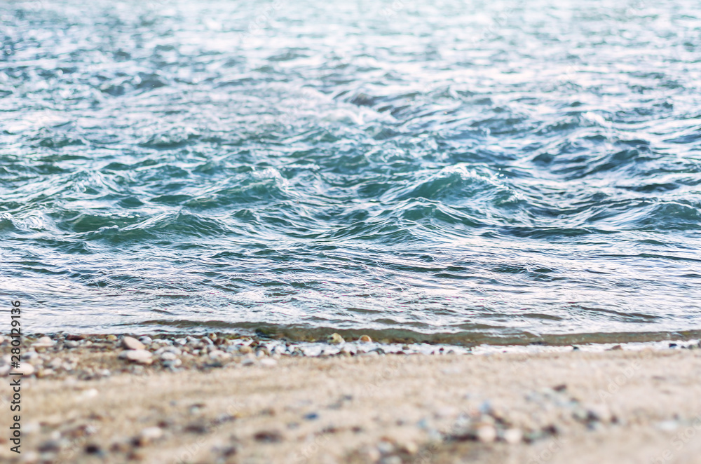 Low Angle View of Fast River Waves, Wet Coarse Sand, Pebble.