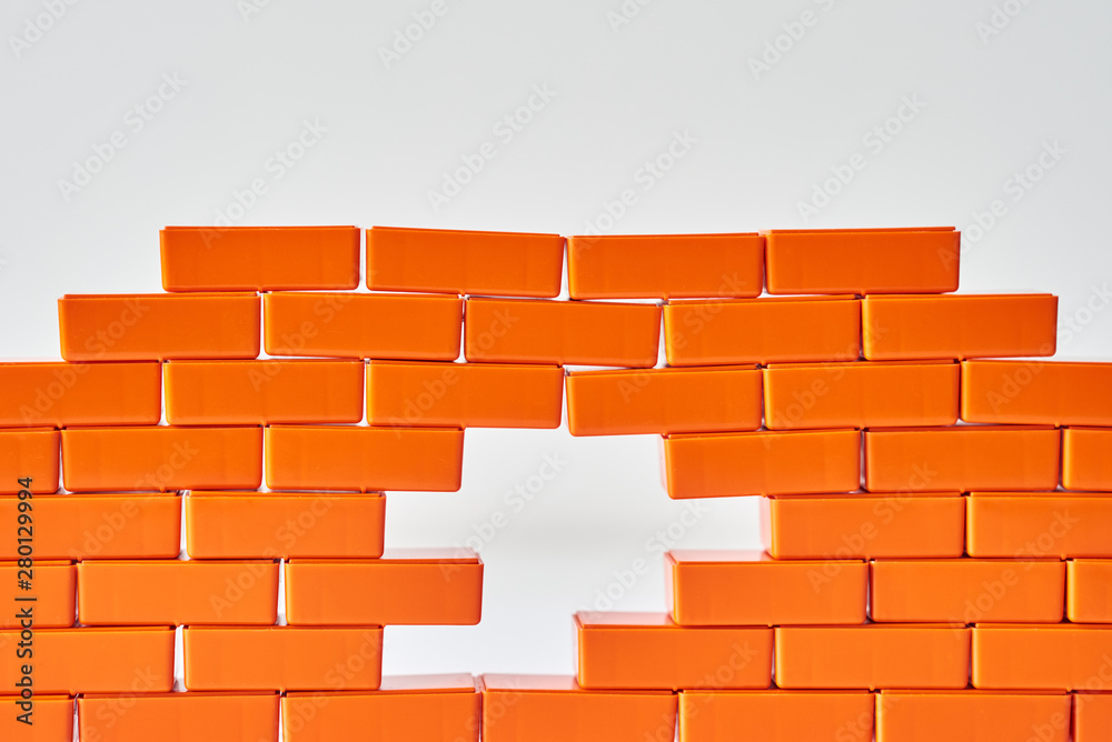 Obraz premium White hole in a brick wall. Frame of Toy block in shape of brick