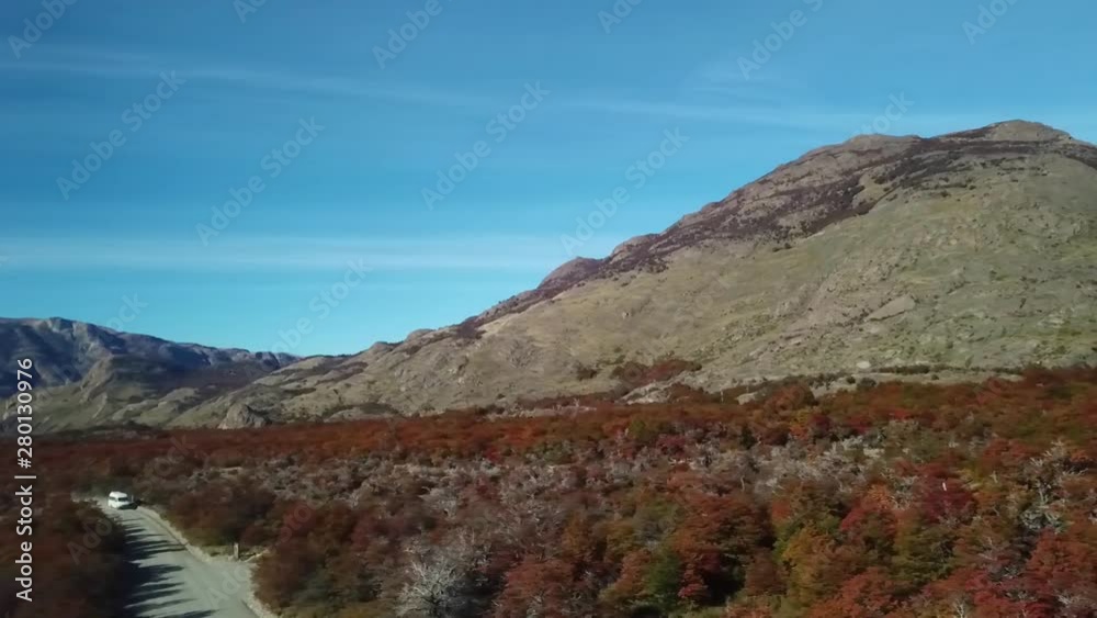 Slow motion aerial panning right shot over autumn forest to fitz roy at El Chalten in Patagonia Argentina Slow motion aerial panning right shot over autumn forest to fitz roy at El Chalten in Patagonia Argentina