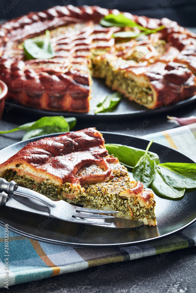 sliced Spinach Ricotta quiche on a plate sliced Spinach Ricotta quiche on a plate