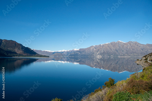 Stunning nature scenery of a beautiful lake nestled under the Southern Alps in New Zealand