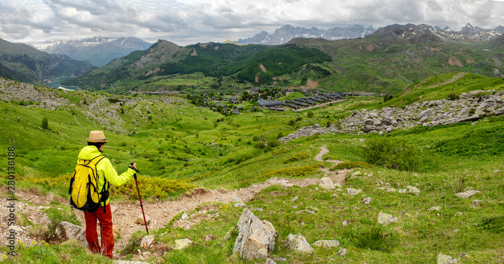 hiker woman with view of Tena Valley in The Pyrenees, Formigal,  Huesca, Spain