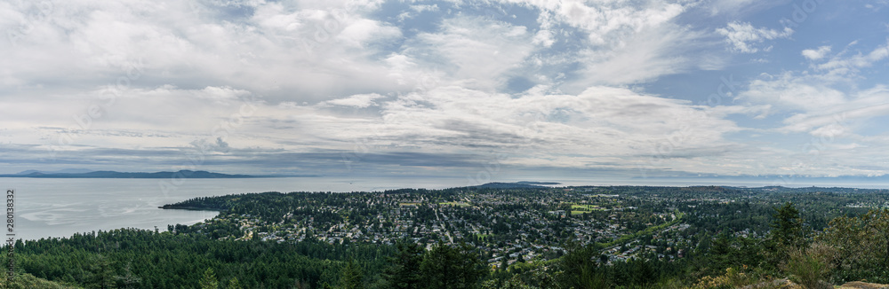 Aerial panoramic view of the city of Victoria from mount Douglas park with a beautiful Pacific Ocean scene.