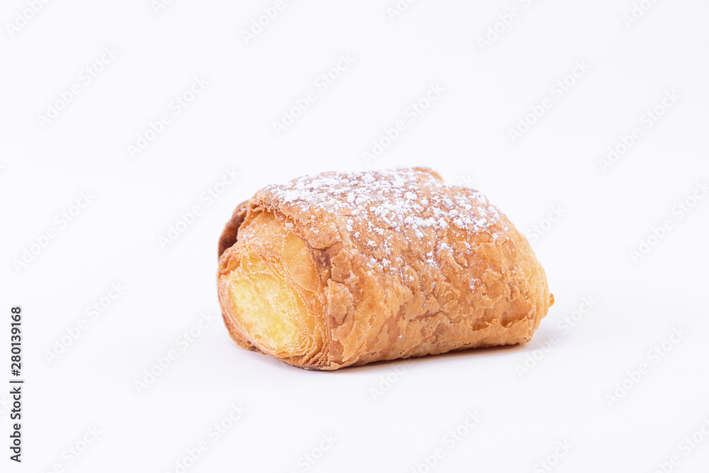 A tasty fresh puff pastry with powdered sugar sprinkled on top A tasty fresh puff pastry with powdered sugar sprinkled on top