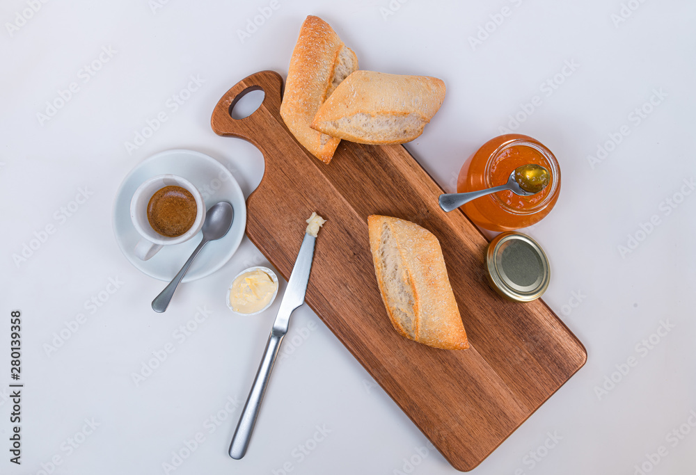 Top view of breakfast for a individual person. Coffee, bread and jam Top view of breakfast for a individual person. Coffee, bread and jam