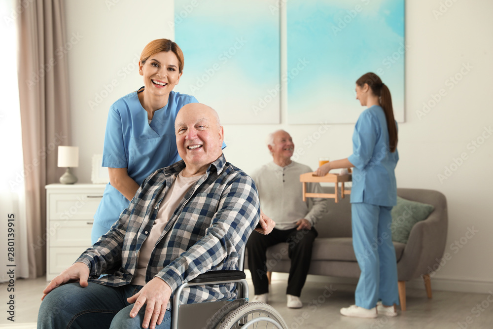 Nurses assisting elderly people at retirement home Nurses assisting elderly people at retirement home