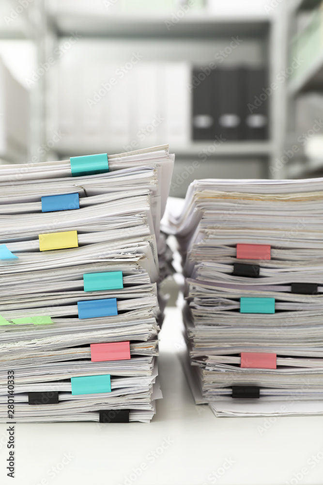 Stacks of documents with paper clips on office desk Stacks of documents with paper clips on office desk