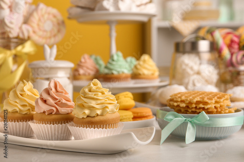Tasty cupcakes and other sweets on table. Candy bar  closeup view