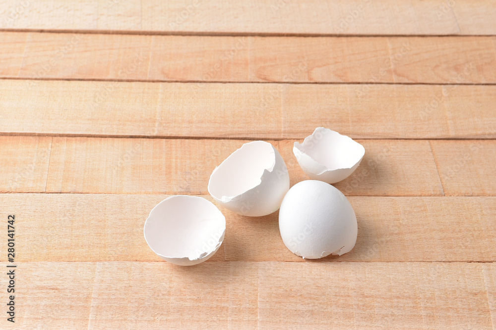 Eggshell on a wooden desk Eggshell on a wooden desk