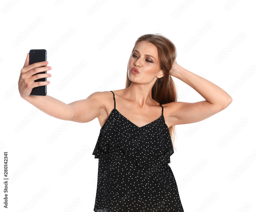 Flirty young woman taking selfie on white background Flirty young woman taking selfie on white background
