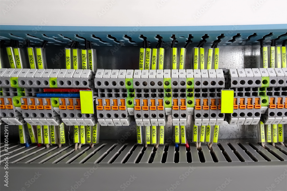 Terminal blocks for electrical connection. Wiring connectors in the assembly of the automation cabinet.