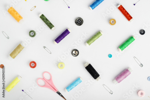 White background with different tools for sewing and tailoring