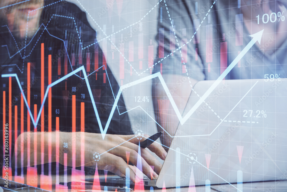 Forex graph with businessman typing on computer in office on background. Concept of analysis. Double exposure. Forex graph with businessman typing on computer in office on background. Concept of analysis. Double exposure.