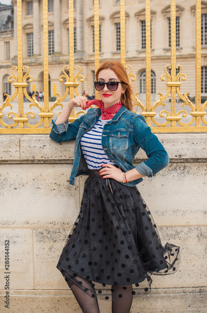 Holidays in Versailles, France. Fashionable pretty woman in trip, concept of vacation. Lady in romantic look outdoor 