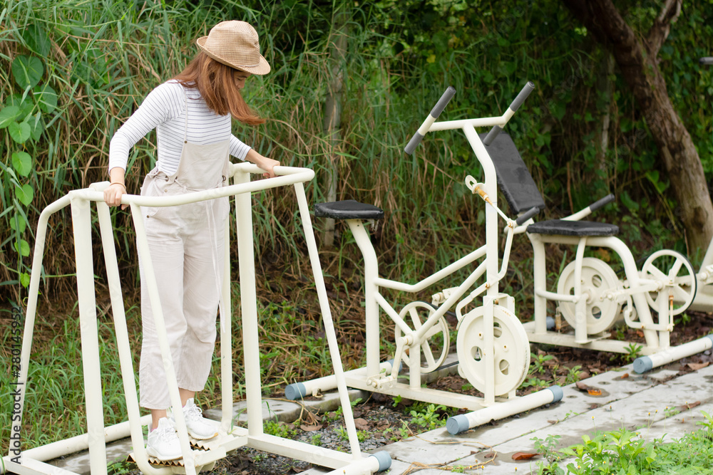 custom made wallpaper toronto digitalPretty girl exercise with machine in the park.