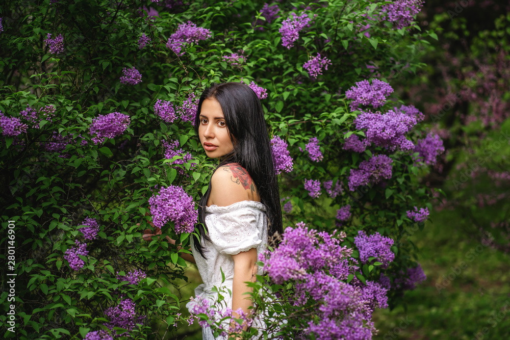 authentic tattooed girl smells a flowering tree authentic tattooed girl smells a flowering tree