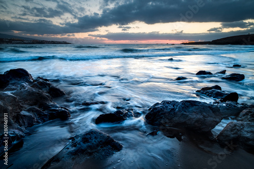 Wild sunset at the beach in winter season. Artistic landscape with sun and sea water. Beautiful concept of travel and adventure alternative vacation. Colors and background with water