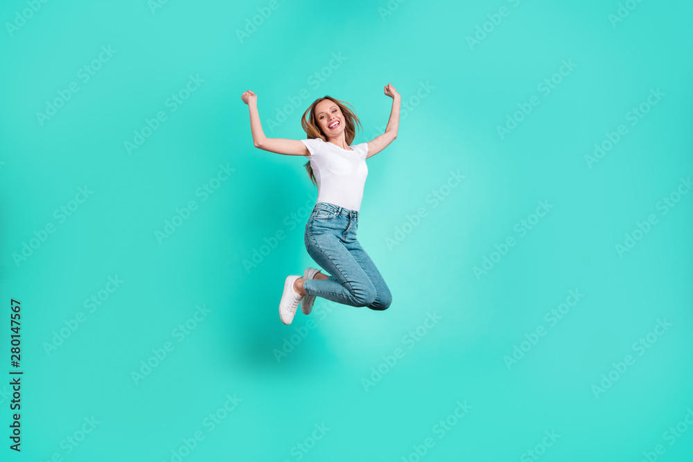 Full size photo of cute excited person raising fists screaming shouting yeah isolated over teal turquoise background