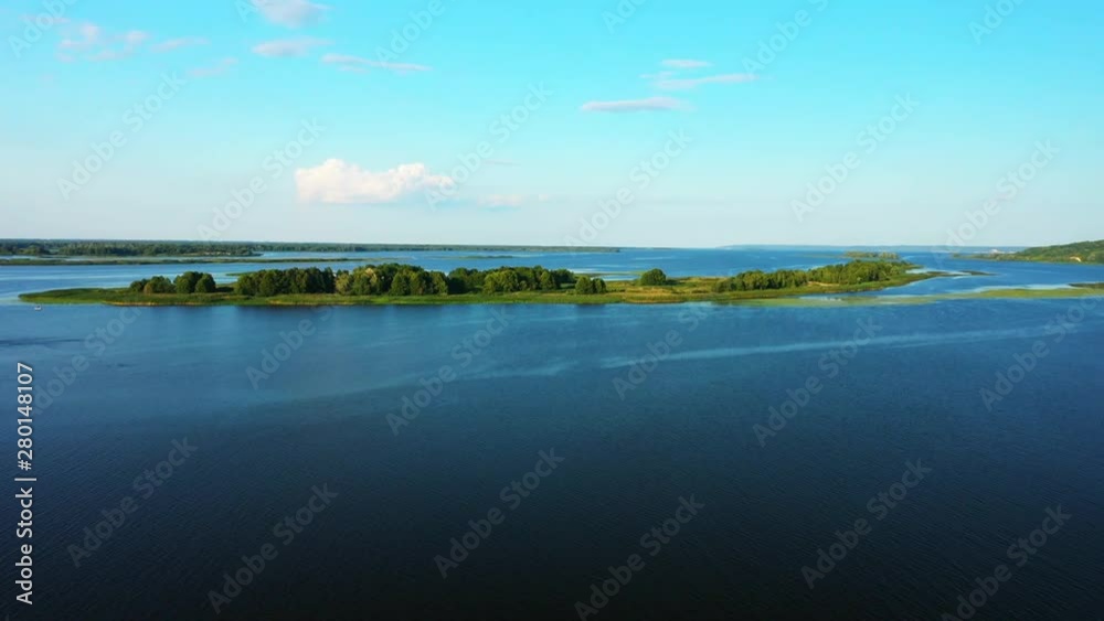 Flight of the camera over the river in the middle of which the island passes Flight of the camera over the river in the middle of which the island passes