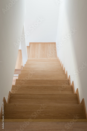 Wooden stairway in modern house from above © ventura